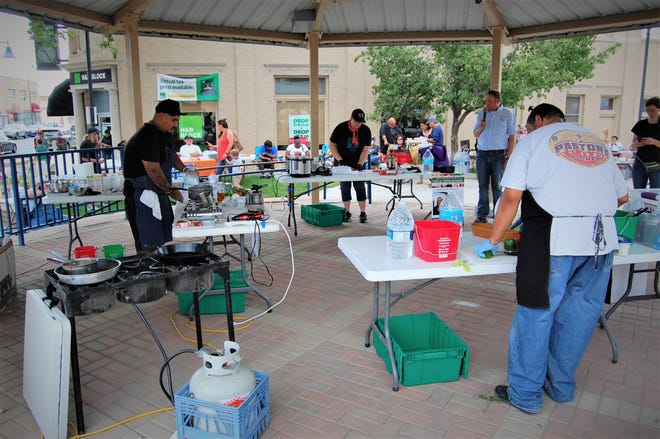 Chefs works on their dishes during the Northwest New Mexico Local Food Summit cook-off on July 15 in Orchard Park in downtown Farmington.
