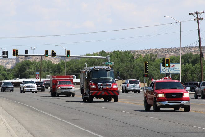 First responders take part in a July 19 motorcade along West Main Street in Farmington. Members of the community helped escort family members of U.S. Army veteran Cecelia B. Finona to Shiprock after her remains arrive in Albuquerque to Shiprock.