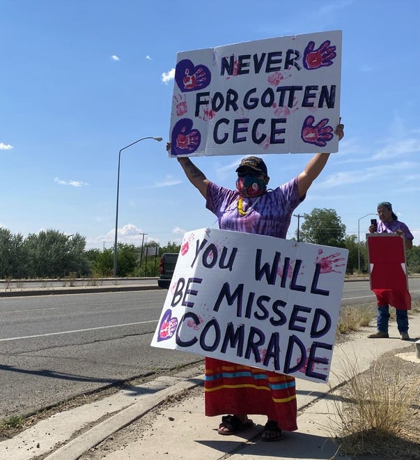 Muzzy Denetso honors U.S. Army veteran Cecelia B. Finona on July 19 as the procession escorting Finona's family members travels to Desert View Funeral Home in Shiprock.