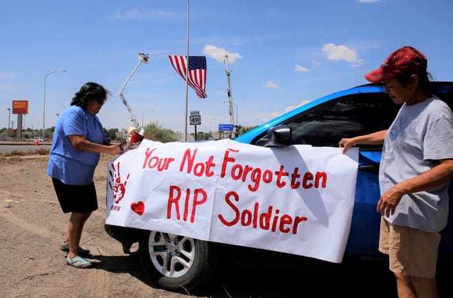 Sisters Marlynda Bidtah, left, and Yvette Bidtah honor the late U.S. Army veteran Cecelia B. Finona on July 19 in Shiprock. Finona was reported missing in June 2019 and her remains were found and identified this year.