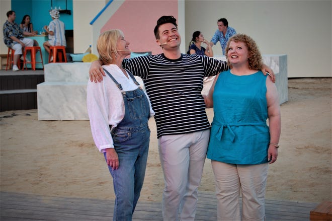 Margaret Clair, left, Nick Drivas and Tina Edlin are featured in a scene from "Mama Mia!" continuing this week at the Lions Wilderness Park Amphitheater in Farmington.
