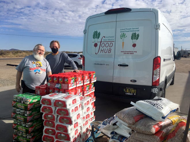 John and Rusty of Deming Helping Hand Food Pantry receive a shipment from the Southwest New Mexico Food Hub..