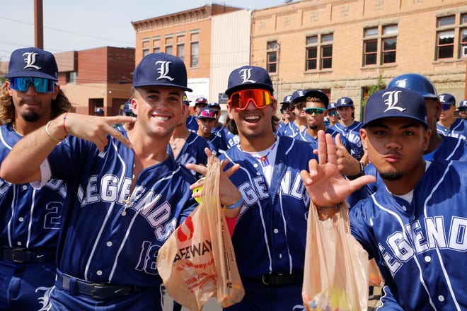 Players from the Florida Legends stop for a photo during the 2021 Connie Mack World Series parade on July 22 in downtown Farmington.