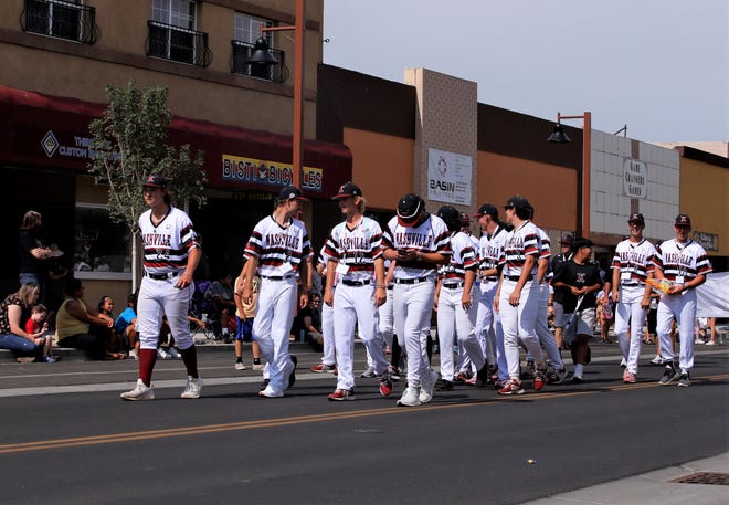 The Nashville Knights walk on Main Street during the 2021 Connie Mack World Series parade on July 22 in downtown Farmington.