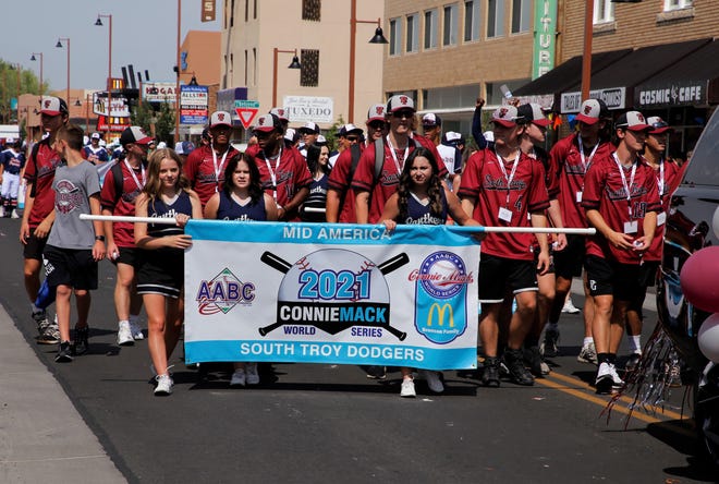 The South Troy Dodgers team walk on Main Street during the 2021 Connie Mack World Series parade on July 22 in downtown Farmington.