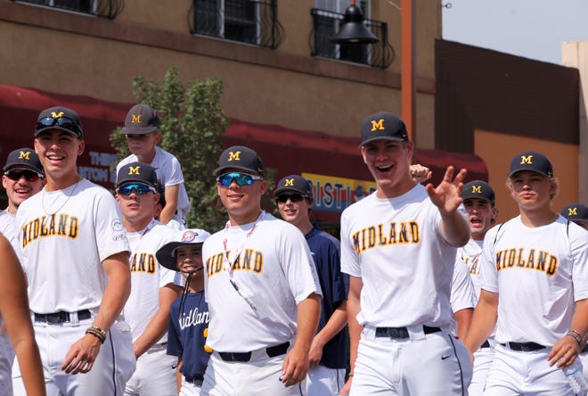 Players from the Midland baseball team greet fans during the 2021 Connie Mack World Series parade on July 22 in downtown Farmington.