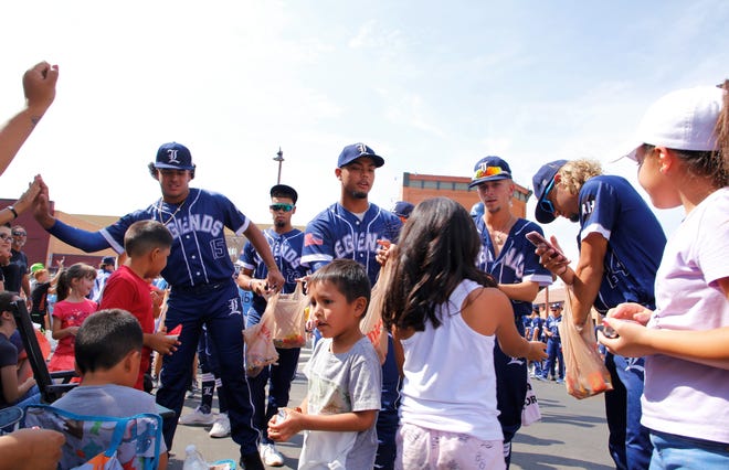Florida Legends players meet fans during the 2021 Connie Mack World Series parade on July 22 in downtown Farmington.
