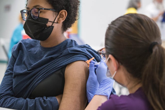 Haleemah Dupass receives a vaccine shot at a vaccination clinic at the Hatch Community Center in Hatch on Saturday, July 24, 2021.