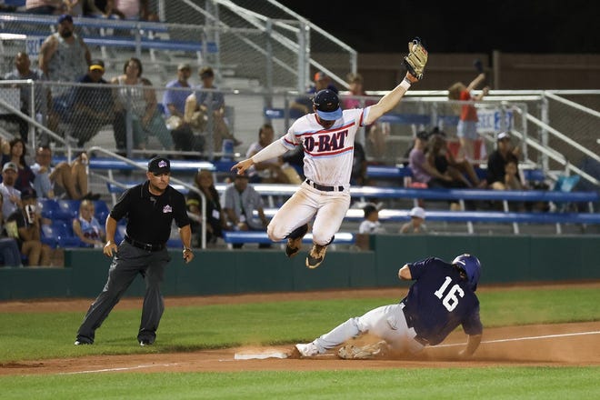 D-BAT United's Gavin Glasgow attempts to tag out Enid Majors' Ty Hammack at third base as he slides in at the top of the fifth inning on Thursday, July 29, at Connie Mack World Series play at Ricketts Park.