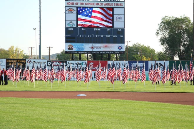 343 American flags, for each of the firefighters who lost their lives on Sept. 11, 2001, adorn the outfield grass at Ricketts Park.