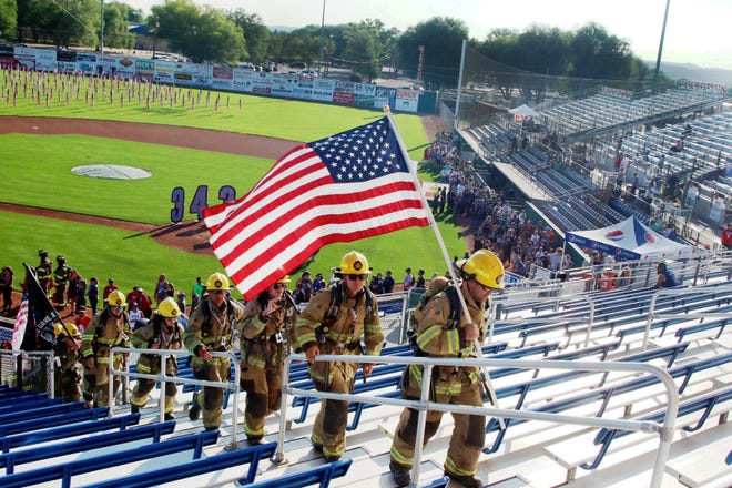 More than 300 volunteers climbed stairs at the Ricketts Park bleachers in honor of the firefighters who died on Sept. 11, 2001.