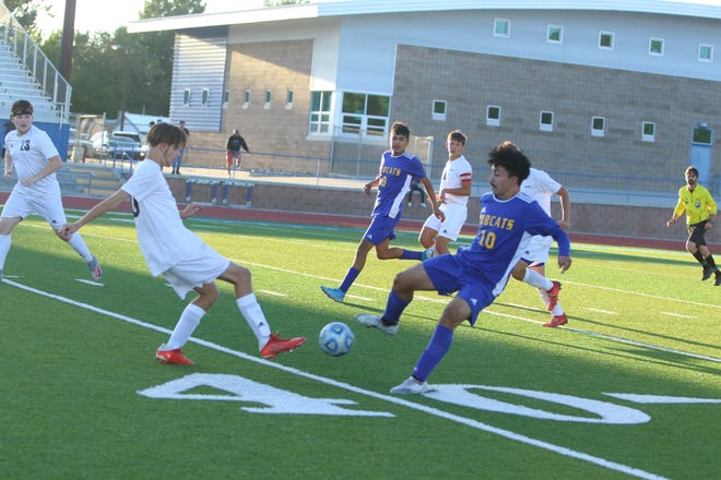 Bloomfield's Jesus Jaquez (10) and Aztec's Logan Whitaker battle for a loose ball during a boys soccer match, Monday, Sept. 20, 2021 at Bobcat Stadium.