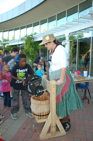 The Real Night at the Museum event planned for Saturday, Sept. 25 at the Farmington Museum at Gateway Park features a variety of historic activities, including apple pressing.