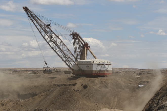A dragline removes a layer of earth to get to coal in the Dixon Pit on Aug. 1, 2019 at Navajo Mine.