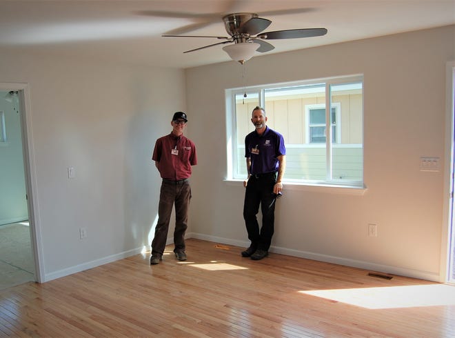 Zachary Pettijohn, left, and Chap Triplett of the building trades program at San Juan College are anticipating lots of interest when the program's two new homes that have been placed up for bid are featured in an open house this weekend.