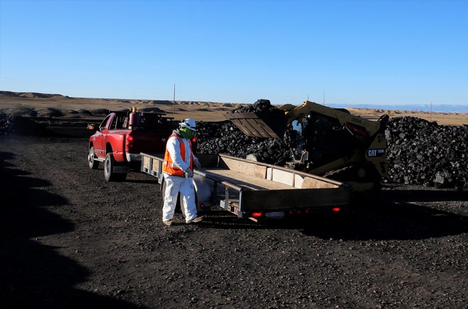 Coal is loaded on Oct. 13 during the Community Heating Resource Program opening day at Navajo Mine.