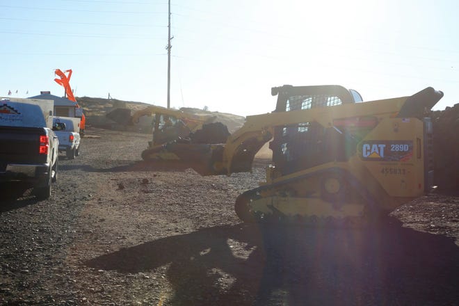 Loaders move coal chunks on Oct. 13 during the opening day of the Community Heating Resource Program at Navajo Mine.