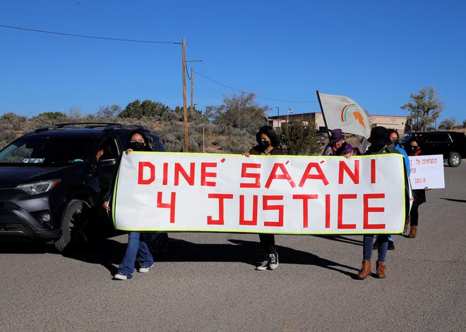 Participants in the Diné Sááni for Justice march leave the Navajo Nation Museum to walk to the Navajo Nation Council chamber on Oct. 18 in Window Rock, Arizona.