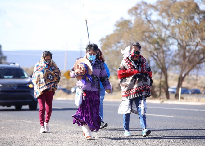 At center left, Delegate Eugenia Charles-Newton, who represents Shiprock Chapter on the Navajo Nation Council, walks in the Diné Sáanii for Justice march in Window Rock, Arizona on Oct. 18.