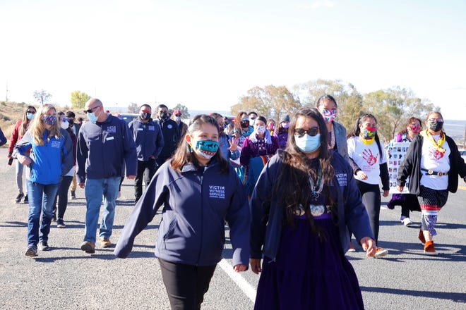 Participants in a walk to raise awareness about domestic violence proceed to the Navajo Nation Council chamber in Window Rock, Arizona on Oct. 18.