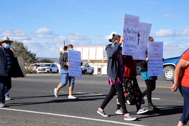Participants in the Diné Sáanii for Justice march walk near the Navajo Police Department in Window Rock, Arizona on Oct. 18.