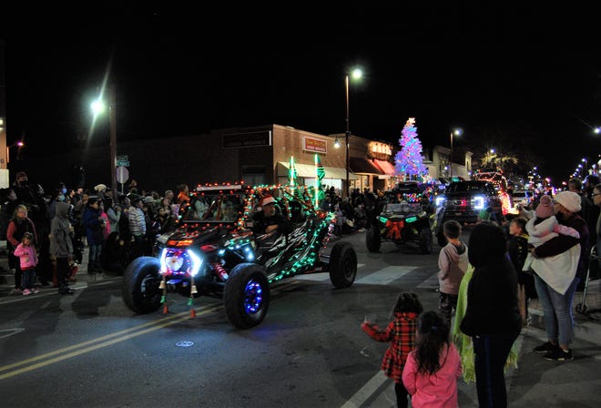 A large crowd greets the entrants in the Farmington Chamber of Commerce's annual Christmas Parade through downtown on Dec. 2.
