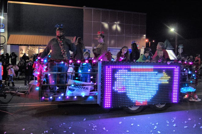A brightly lit float is towed down Main Street during the Christmas Parade through downtown Farmington on Dec. 2.