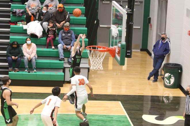 Farmington High School's Caden Granger puts up a 3-point shot against Gallup during their third game of the Marv Sanders Invitational Tournament, Saturday, Dec. 18, 2021 at Farmington High School.