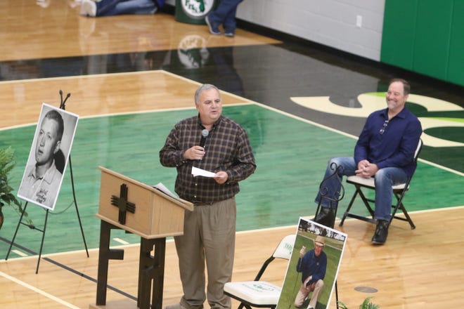 Marty Saiz, past president of the New Mexico Sports Hall of Fame and sports historian, remembers the career and legacy of the late Marv Sanders during a tribute joined by Marv's son Mike between games Saturday in the Scorpion Arena at Farmington High School.