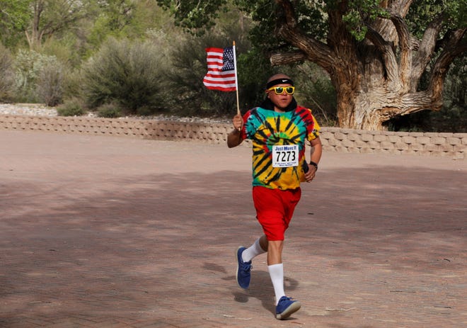 Travis J. Begay runs at Berg Park in Farmington on May 11 as part of the Just Move It event.