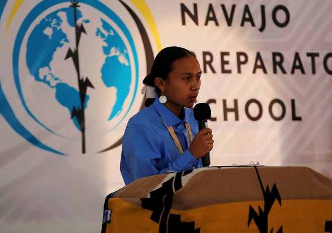 Navajo Preparatory School student Watson Whitford serves as master of ceremonies during the event to mark the school's 30th anniversary on May 12 in Farmington.