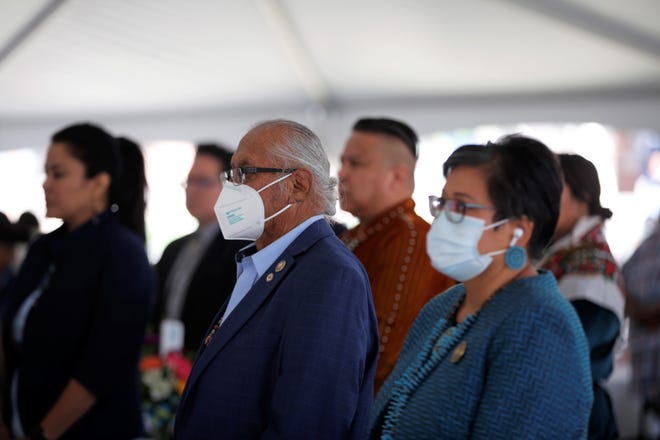 Delegate Daniel E. Tso, center, sponsored the tribal council bill in 1991 to form the charter to establish Navajo Preparatory School and to appoint a task force to acquire the site in Farmington. He stands for an honor song during the school's 30th anniversary on May 12.