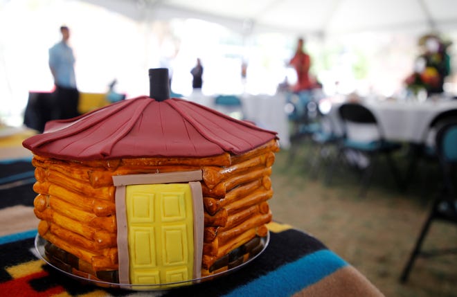 A replica of Navajo Preparatory School's hogan sits after its removal from the top of the cake to celebrate 30 years of the school on May 12 in Farmington.
