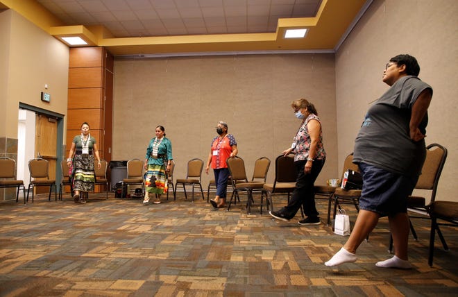 Celebration of Women Conference attendees learn about tai chi on June 30 during the event hosted by Sisters in Circle at the Farmington Civic Center.