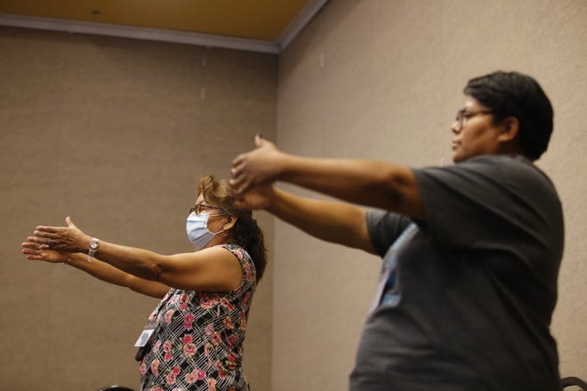 Attendees learn about tai chi on June 30 during the Celebration of Women Conference hosted by Sisters in Circle at the Farmington Civic Center.
