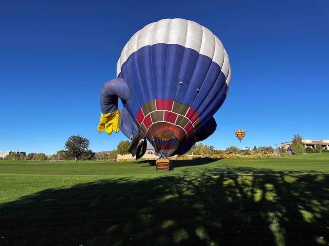 The phrase "What goes up must come down" certainly applies to hot air balloons. This balloon's flight from Farmington Lake Sept. 24 ended safely at San Juan Country Club.