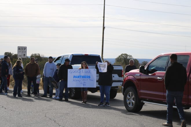 Parents and fans of the Piedra Vista High School football team show their support for the Panthers Friday, Nov. 18, 2022 as they leave for a long road trip to Roswell and a Class 5A semifinal game on Saturday at the Wool Bowl against the Coyotes.